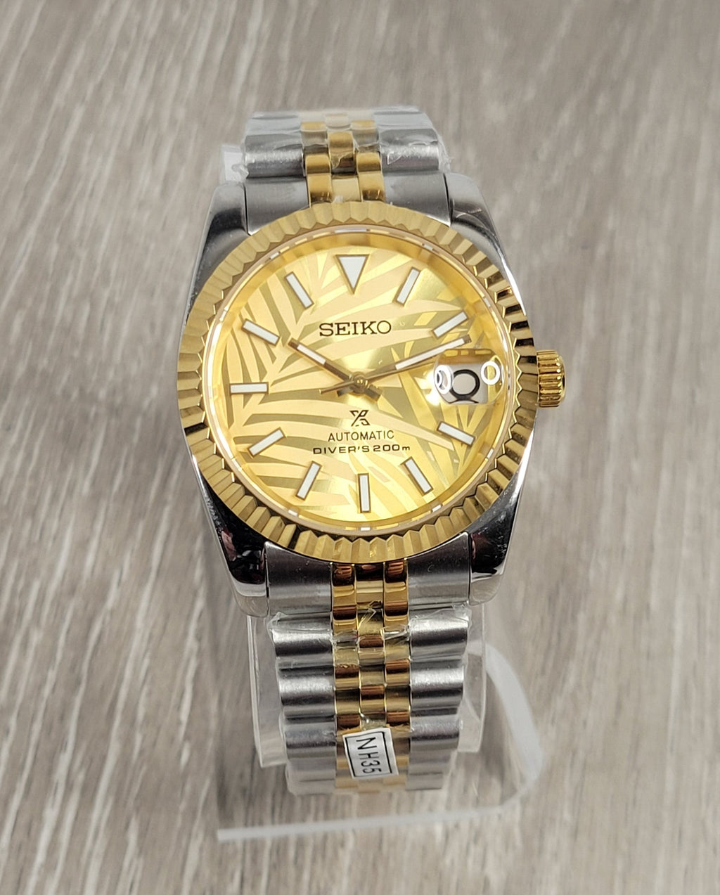 Gold Palm Dial Date Watch
