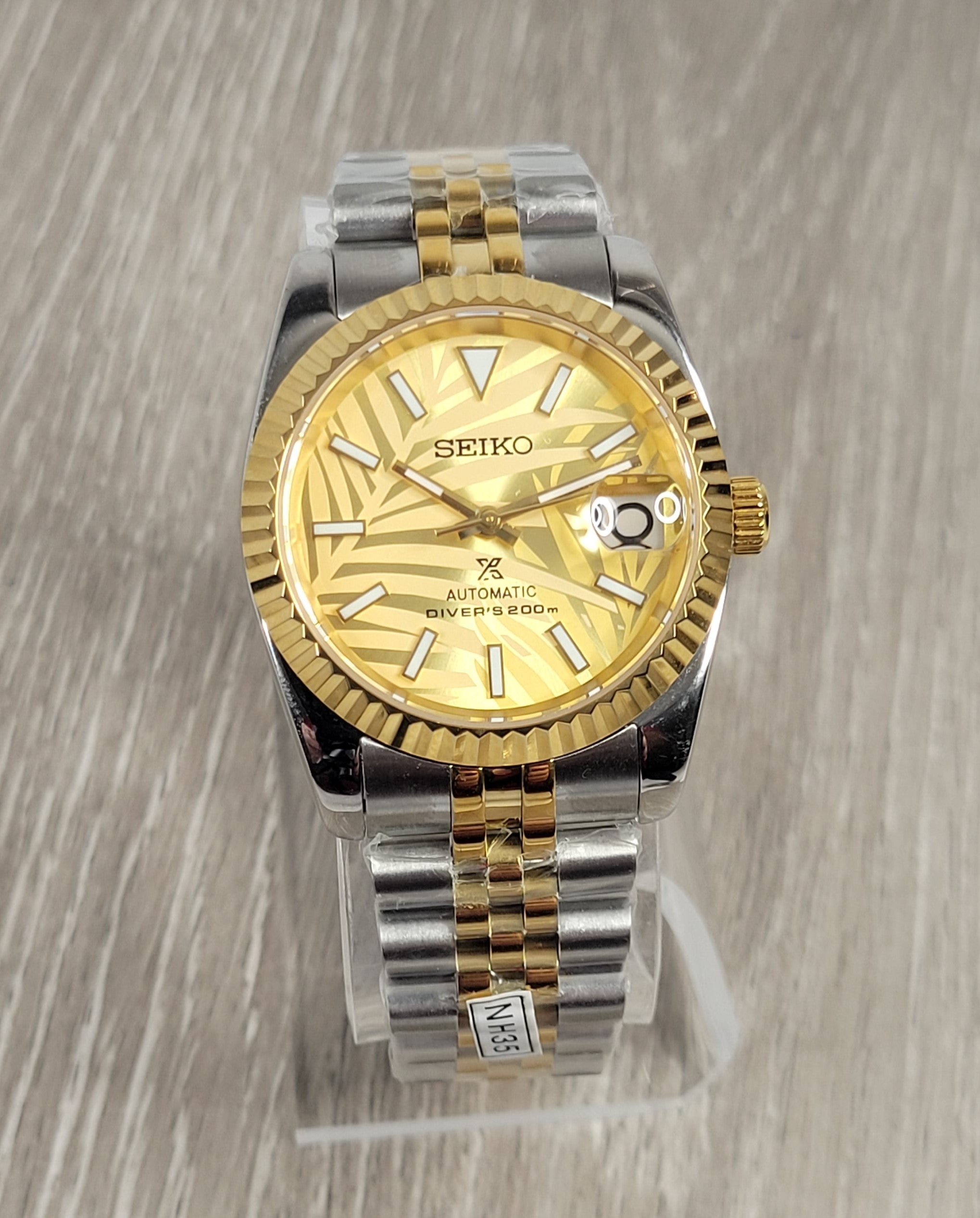 Gold Palm Dial Date Watch