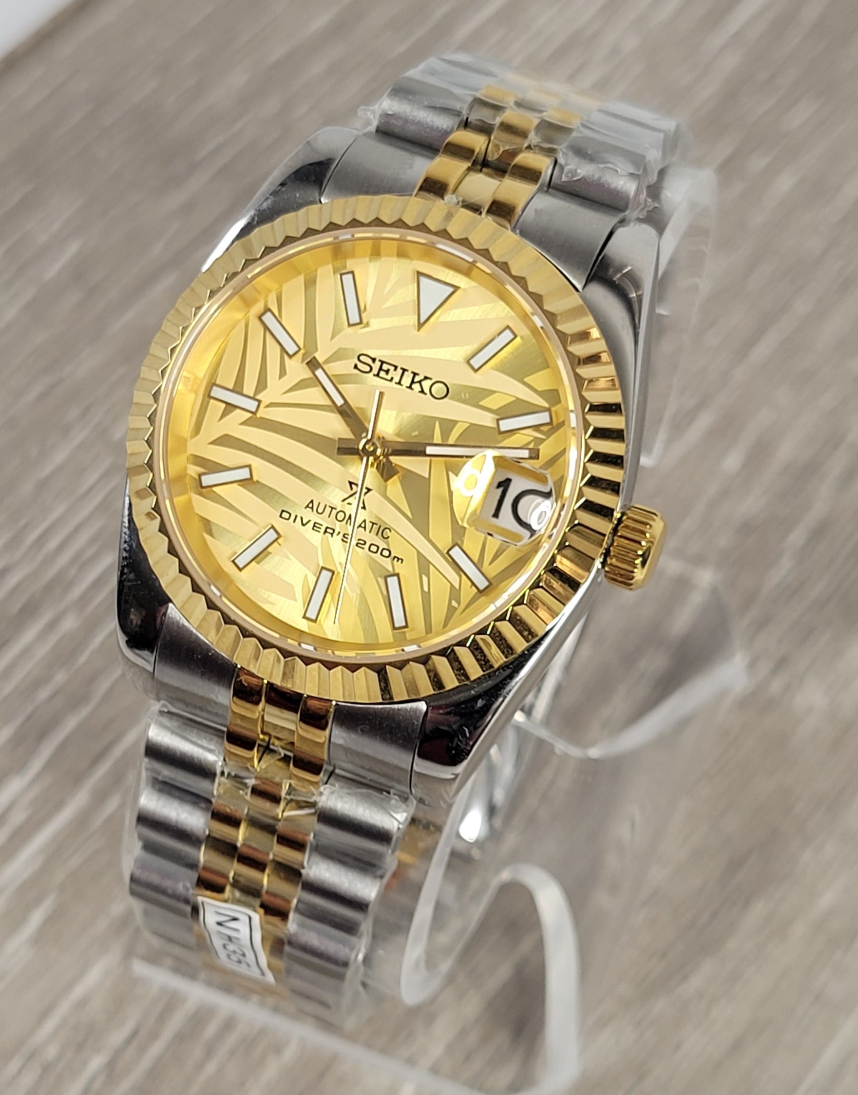 Gold Palm Dial Date Watch