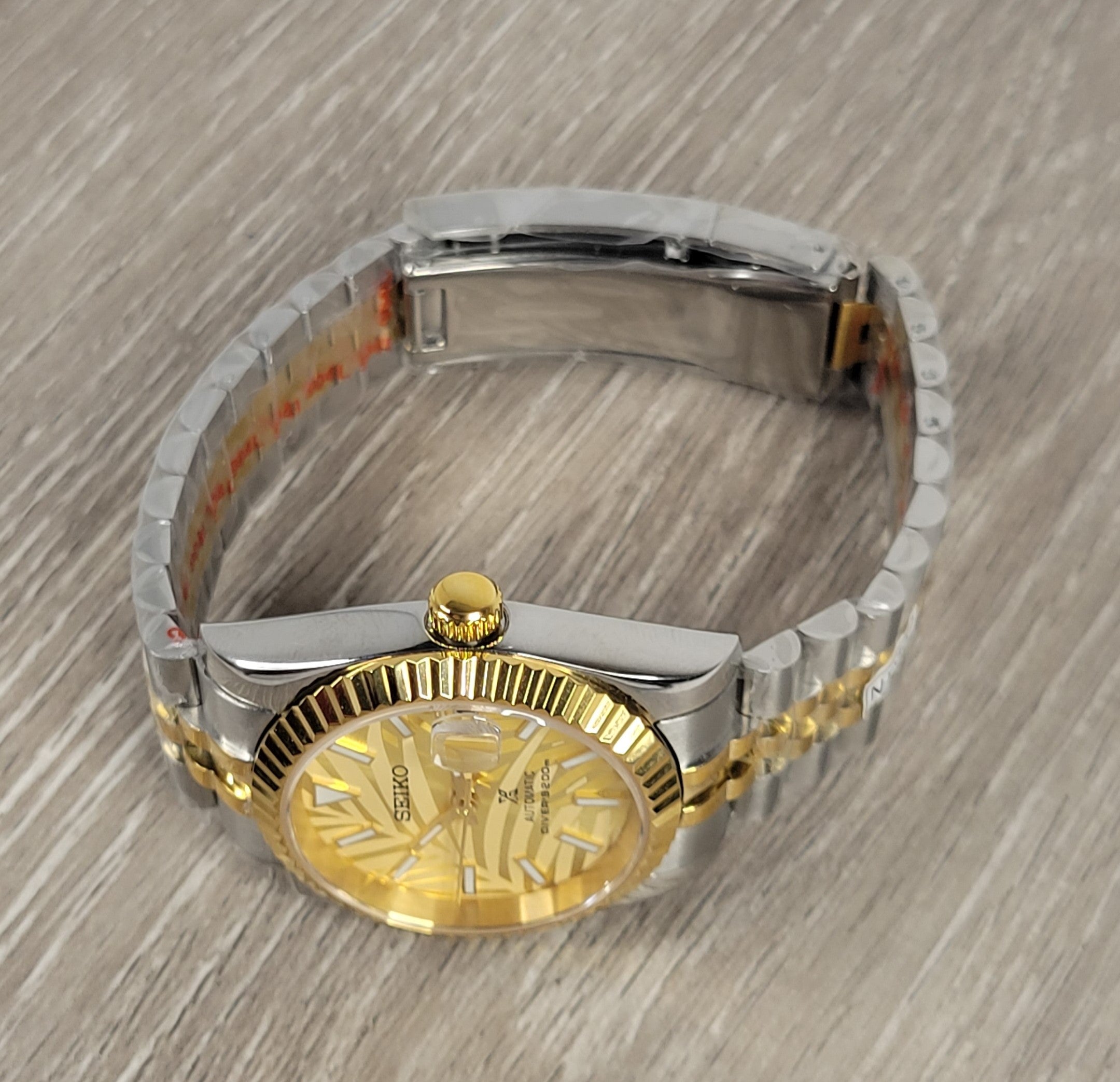 Gold Palm Dial Date Watch